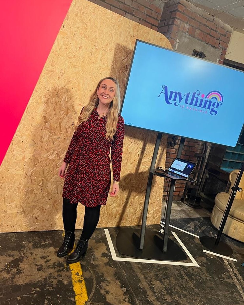 Katie Ford speaking on stage at Anything Is Possible